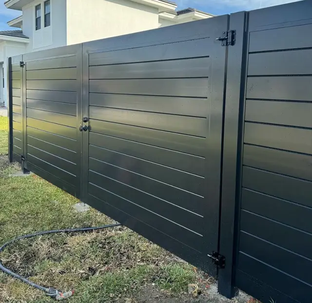 Custom metal double gate fence installed by Florida Fence Solution in Broward County