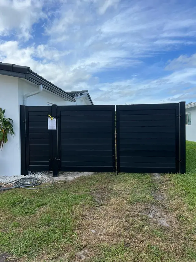Custom metal gates fence installed by Florida Fence Solution in Broward County