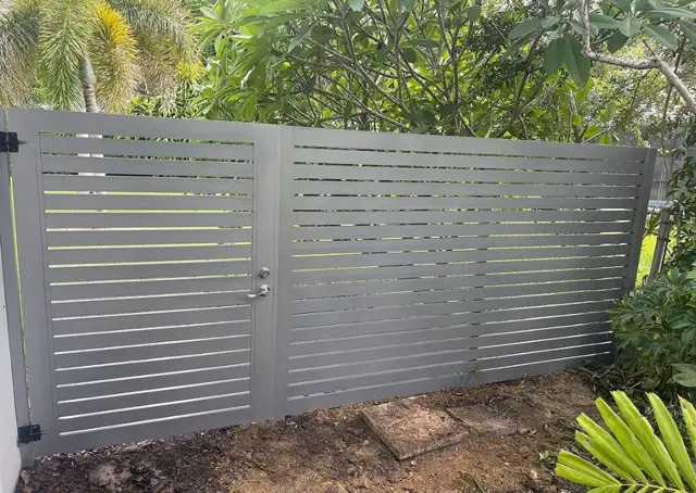 Horizontal slat gate fence installed by Florida Fence Solution in Broward County