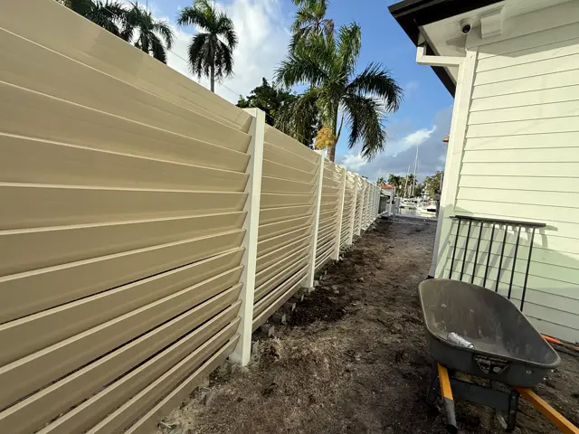 Louvered PVC, tan fence installed by Florida Fence Solution in Broward County