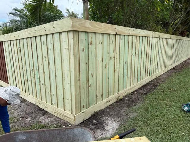 Custom capped wood fence installed by Florida Fence Solution in Broward County