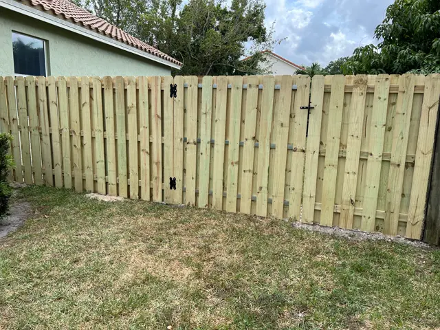 Shadowbox with gate fence installed by Florida Fence Solution in Broward County